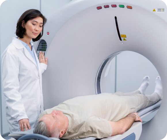 Patient being assisted by a mentor before undergoing an MRI scan with a 1.5 Tesla wide bore machine