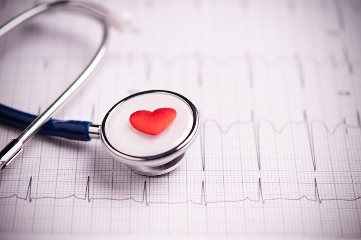 Stethoscope placed on a heart, symbolizing heart health and medical evaluation