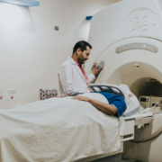 You will lie still on the CT table while the machine scans your chest.